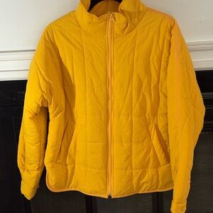 Yellow puffer jacket. Oversized small. Never worn. No tags.